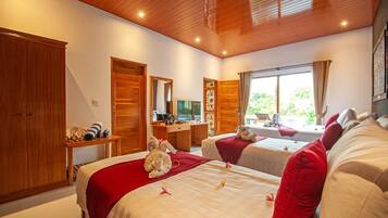 A hotel room with two beds, wooden ceiling, a desk with a chair, a TV, and a window with curtains.