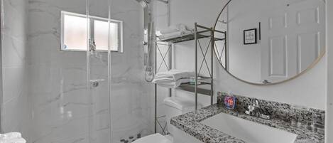 Shower, hair dryer, towels, soap
