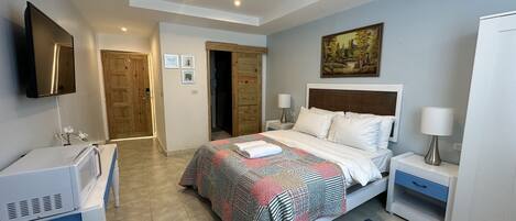 1 bedroom, desk, iron/ironing board, travel crib