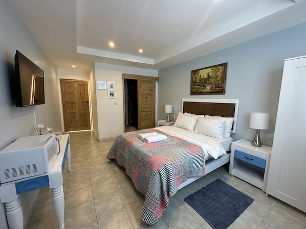 1 bedroom, desk, iron/ironing board, travel crib