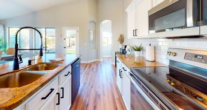 Power Ranch home with private pool, outdoor areas & a park across the street