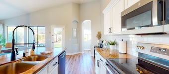 Power Ranch home with private pool, outdoor areas & a park across the street