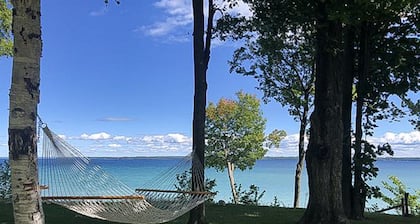 Dog-friendly secluded home near Suttons Bay with water views, firepit, fireplace