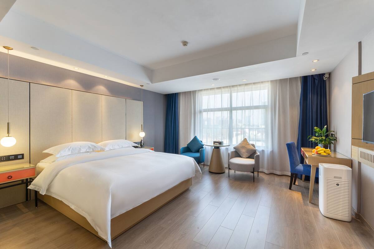 ห้องดีลักซ์ดับเบิลสำหรับพักเดี่ยว | เครื่องนอนระดั  บพรีเมียม, ผ้านวมขนเป็ด, มินิบาร์, โต๊ะทำงาน