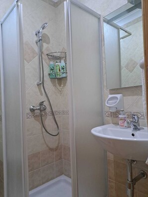 Shower, free toiletries, hair dryer, towels
