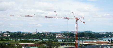 A construction site with a large crane and a partially built structure.
