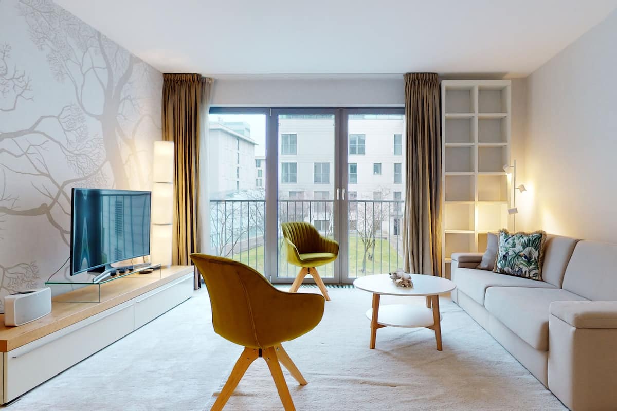 Deluxe Apartment | Living area | 55-inch Smart TV with satellite channels, TV