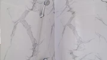Economy Double Room | Bathroom | Shower, rainfall showerhead, towels, toilet paper