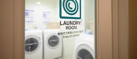 A laundry room with a sign indicating it is free of charge.
