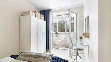 Superior Apartment | Living area | 26-inch flat-screen TV with cable channels