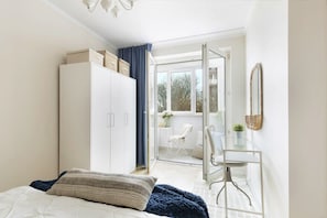 Superior Apartment | Living area | 26-inch flat-screen TV with cable channels