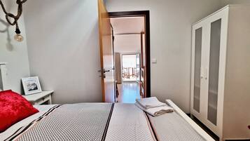 2 bedrooms, soundproofing, iron/ironing board, travel cot