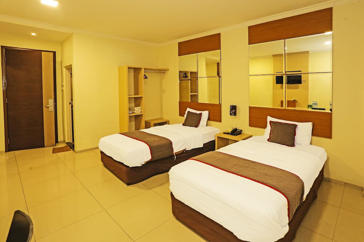 Habitación Deluxe con 2 camas individuales | Wifi gratis y ropa de cama