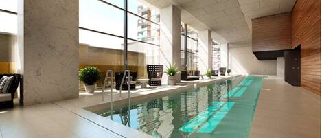 Indoor pool, open 7:00 AM to 11:00 PM, pool loungers