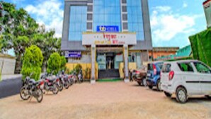 A building with a sign that reads "Hotel". - Renuka Executive (Rajgurunagar)