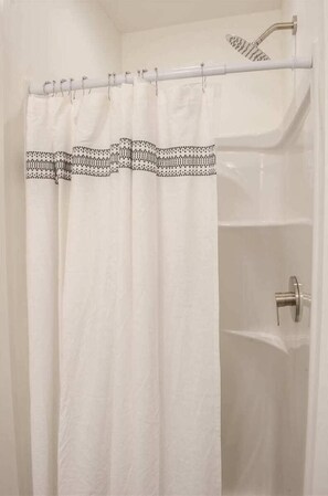 Bathtub, hair dryer, towels, soap