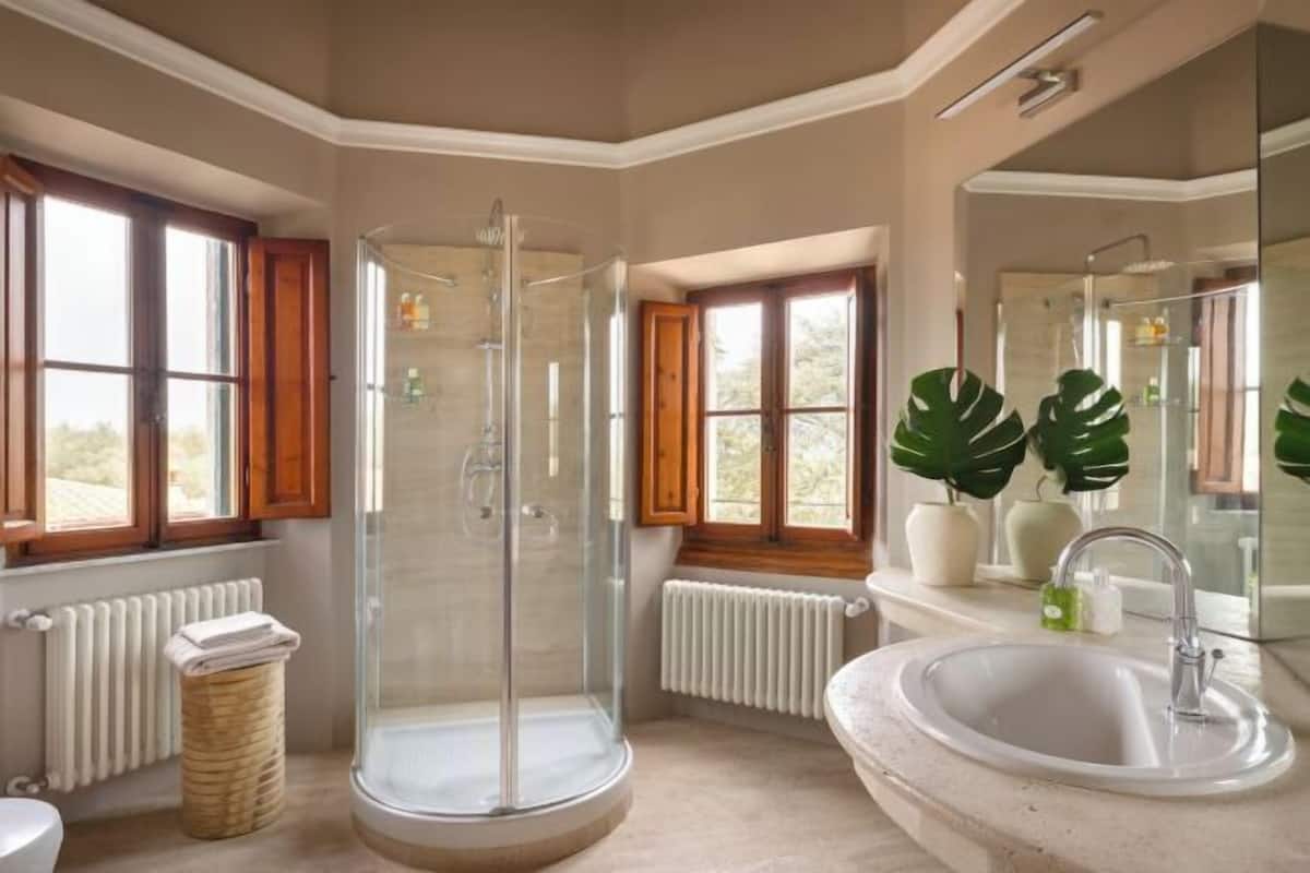 Shower, rainfall showerhead, designer toiletries, hair dryer
