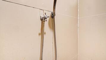 Shower, rainfall showerhead, towels, toilet paper