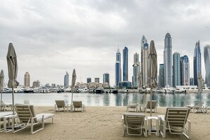 Private beach, beach umbrellas