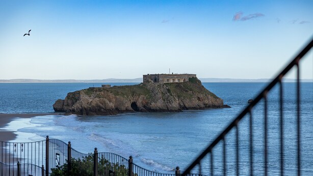 A coastal fortification with a staircase leading up to it, overlooking the sea. - Caldey Bay Apartment - Lovely Sea Views (Tenby)