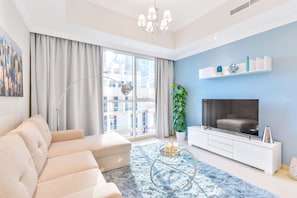 Deluxe 1BR Apartment | Living area