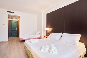 Triple Room | Down comforters, minibar, in-room safe, desk
