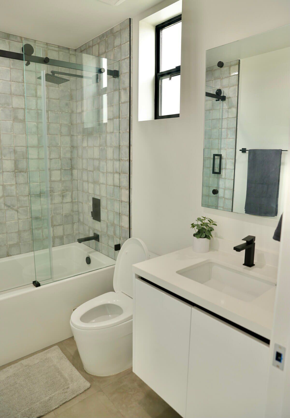 Bathtub, hair dryer, towels, shampoo