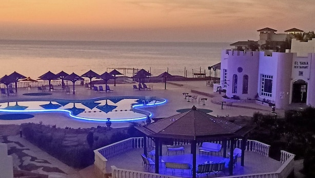 A beachside resort with a central gazebo, sun loungers, and a restaurant named "EL TABIA RESTAURANT". - Grand Halomy resort (Sharm El Sheikh)