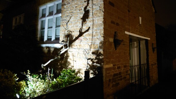 A brick building with a window and a satellite dish. - Fully Detached Cottage House Loddington Kettering (Kettering)