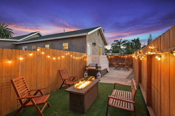 Turfed Backyard with Intimate Lighting