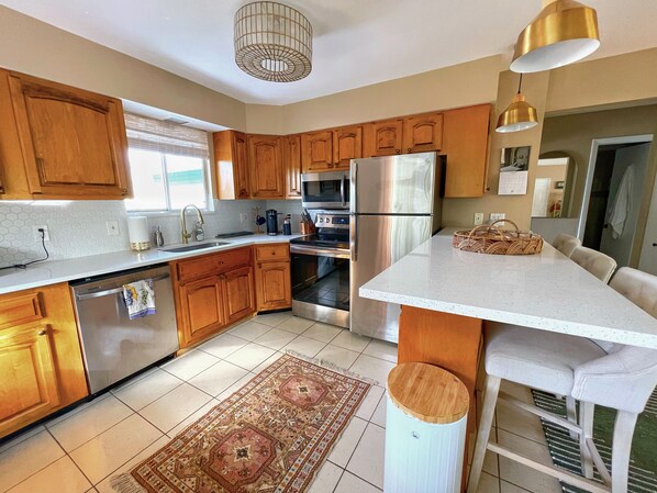 Fridge, microwave, oven, stovetop - Chic Cali-Inspired Condo On Canal w/ Pool (Bonita Springs)