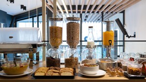 A breakfast buffet with various food items and a coffee machine. - Nema Hotel Athens (Athens)
