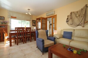 Relax in this inviting living area with a dining set and comfortable seating.