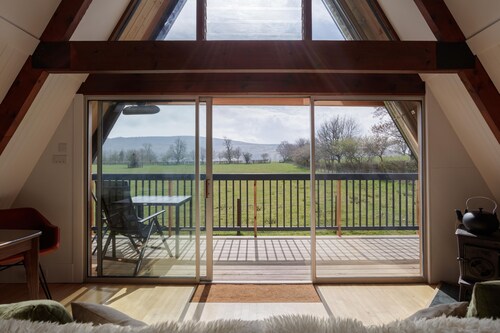 Midpark is a chic A-Frame nestled in the romantic scenery of the Deveron valley. Relax and feel refr