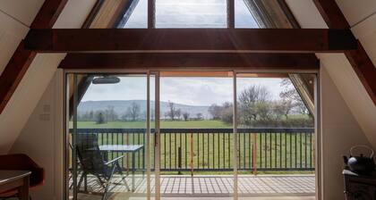 Midpark is a chic A-Frame nestled in the romantic scenery of the Deveron valley. Relax and feel refr