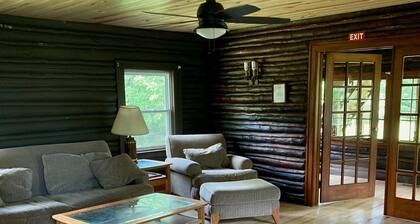 Cozy Beautiful log cabin situated on acreage with access to East Stylus Lake