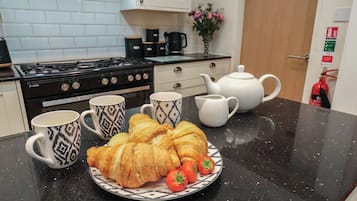 Fridge, electric kettle, toaster, cookware/dishes/utensils