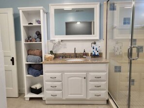 Shower, hair dryer, towels, soap