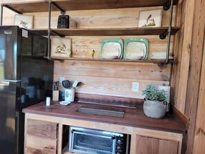 Fridge, coffee/tea maker, toaster, cookware/dishes/utensils