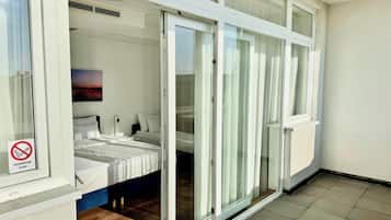 Triple Room, Balcony | Desk, laptop workspace, free WiFi, bed sheets