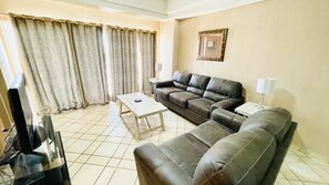 Condo, 2 Bedrooms | Living area - Spectacular 2 Bedroom Condo on Sandy Beach at Las Palmas Resort B-104 2 Condo by RedAwning (Puerto Peñasco)