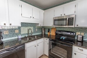 Condo, 2 Bedrooms | Private kitchen | Fridge, oven, coffee/tea maker, toaster