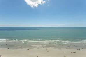 A beach with clear skies and calm waters.