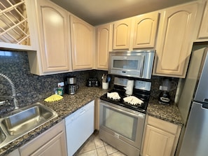 Condo, 2 Bedrooms | Private kitchen | Fridge, oven, coffee/tea maker, toaster