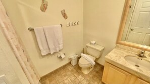 A bathroom with a toilet, sink, and towel rack. - Beautiful 1Â½ Bedroom Condo on the Sea of Cortez at Las Palmas Resort D-302 2 Condo by RedAwning (Puerto Peñasco)