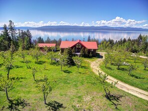 Escape to a serene lakeside retreat with views of the lake and distant mountains.