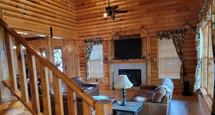 Country estate log cabin, elevated wrap around porch. Live Oak, Cypress and Pine