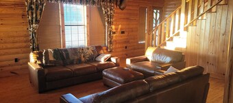 Country estate log cabin, elevated wrap around porch. Live Oak, Cypress and Pine