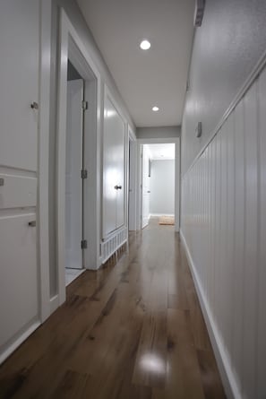 Corridors lead to individual rooms with standard doors.