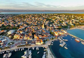 Overlooking the marina, this coastal town offers stunning views of the sea and surrounding mountains.